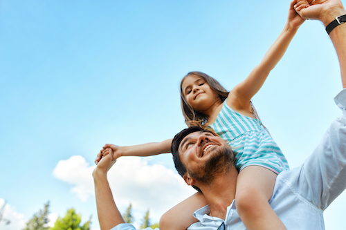 Happy Father And Child Having Fun Playing Outdoors. Smiling Young Dad And Daughter Spending Time Together In Nature. Parent And His Kid Relaxing In Park. Family Time, Relationships Concept