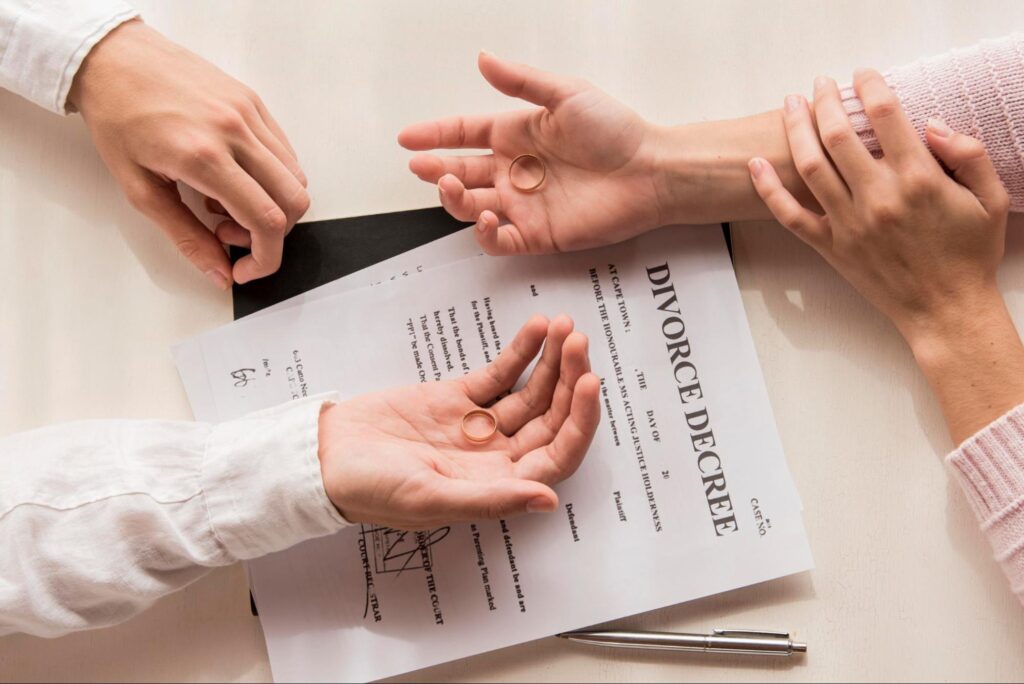 People signing divorce papers